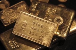 Gold at 5-month low, socked by U.S. yields and dollar