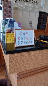 Americans relying less on cash, more on credit cards may pay more fees. Here’s why.