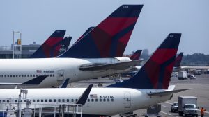 Delta lays off some corporate workers to cut costs